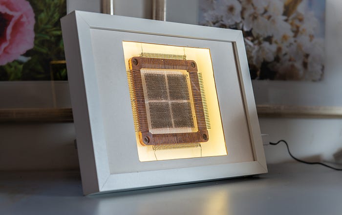 Photograph of the core memory plane inside a lighted display frame.