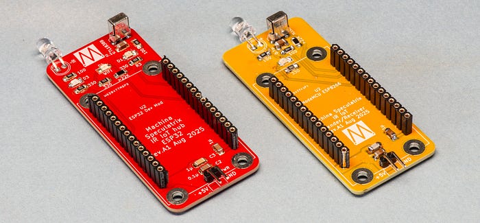 Photograph of two PCB boards (one red, one yellow) each with two rows of female header pins, an LED and a sensor.