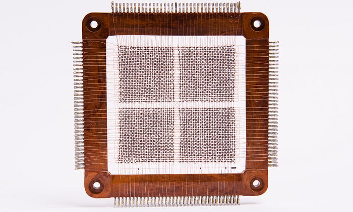 Close-up photograph of magnetic core memory from a 1960s computer.