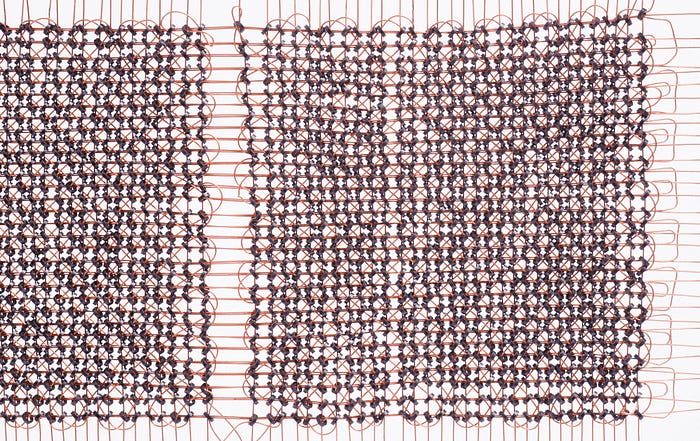 Close-up photograph of magnetic core memory from a 1960s computer.