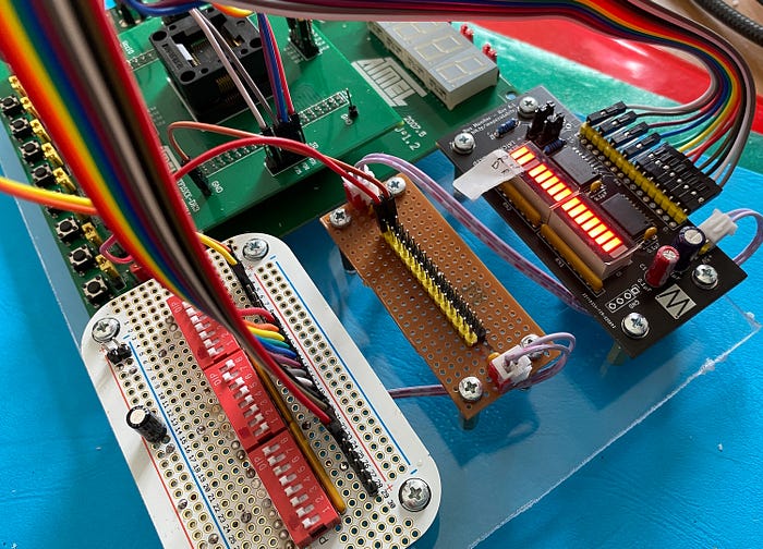 Close-up photograph of electronics prototyping boards with switches and LEDs.