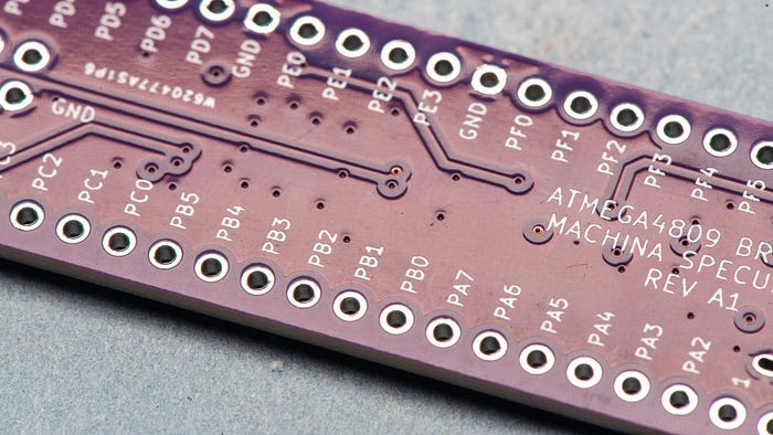 Close-up photograph of a PCB showing the pin socket labelling