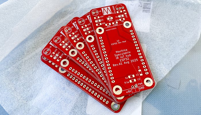 A close-up photograph of six red PCBs lying on fleece-like paper.